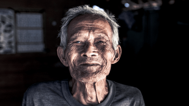 Local elderly man smiling
