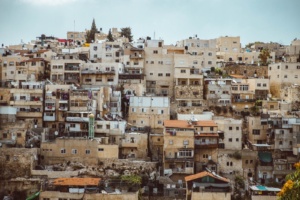 Houses in a slum. The buildings appear to be falling apart.