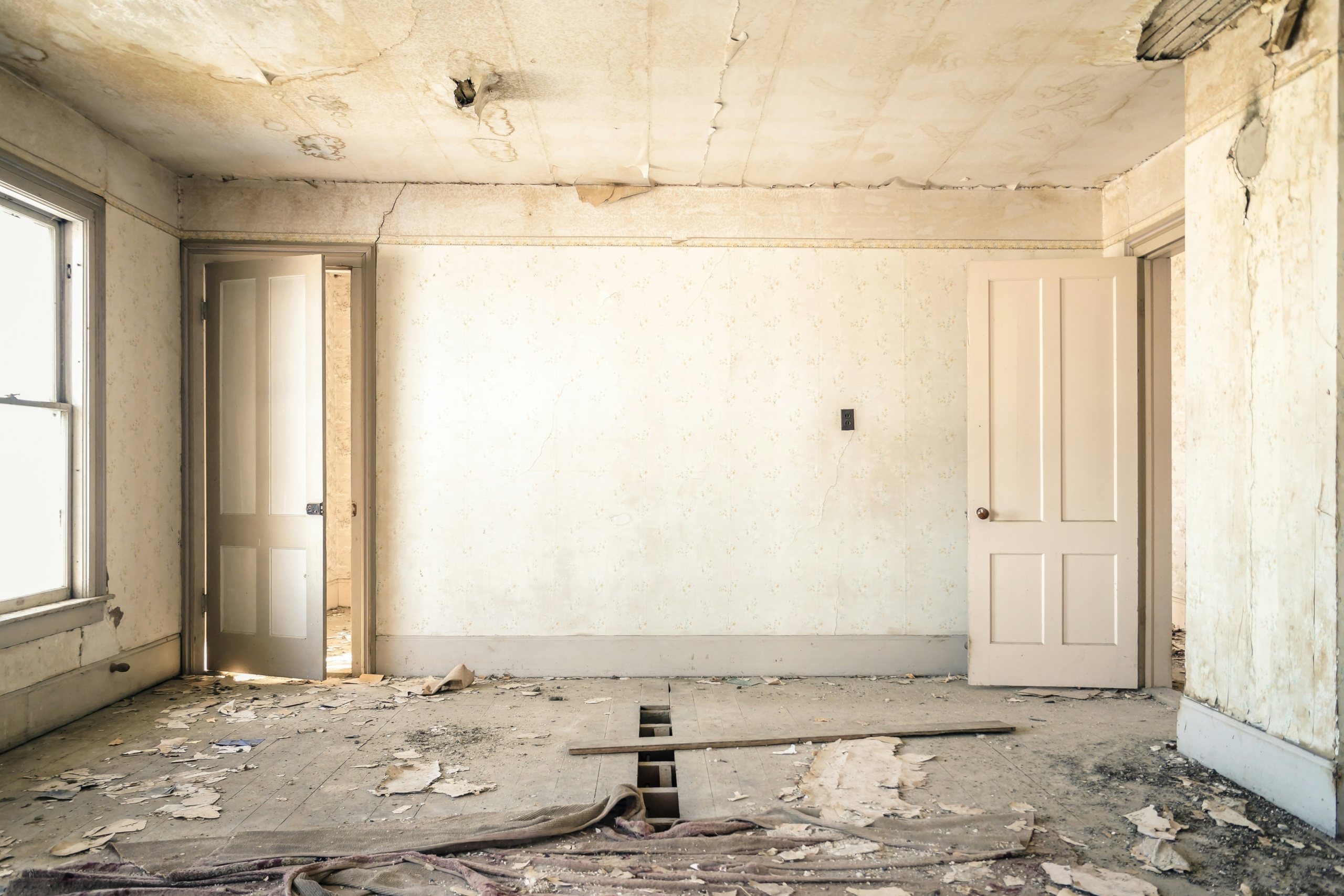 interior of a home that is falling apart.