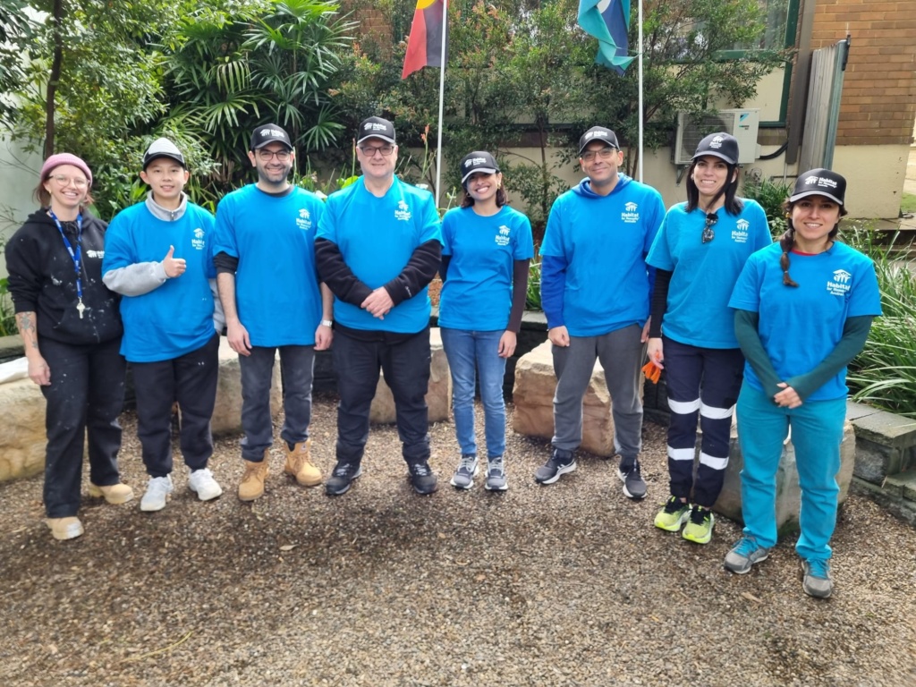 Volunteers stand in a line at Rainbow Lodge