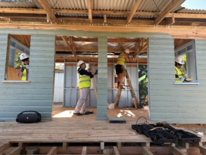 Global Village build in Fiji - volunteers build inside a home