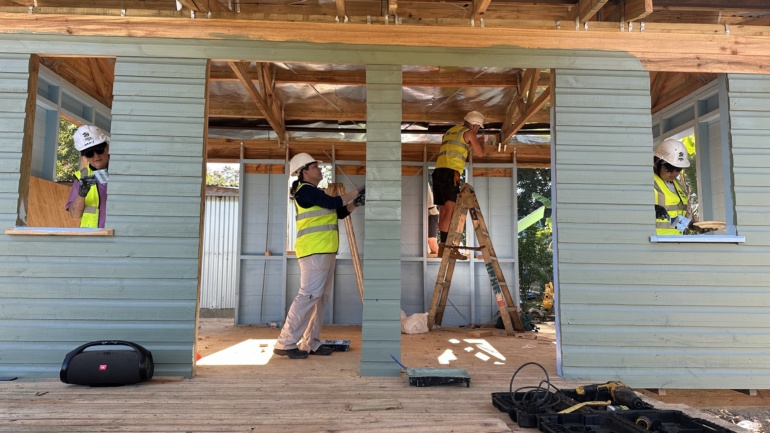 Global Village build in Fiji - volunteers build inside a home