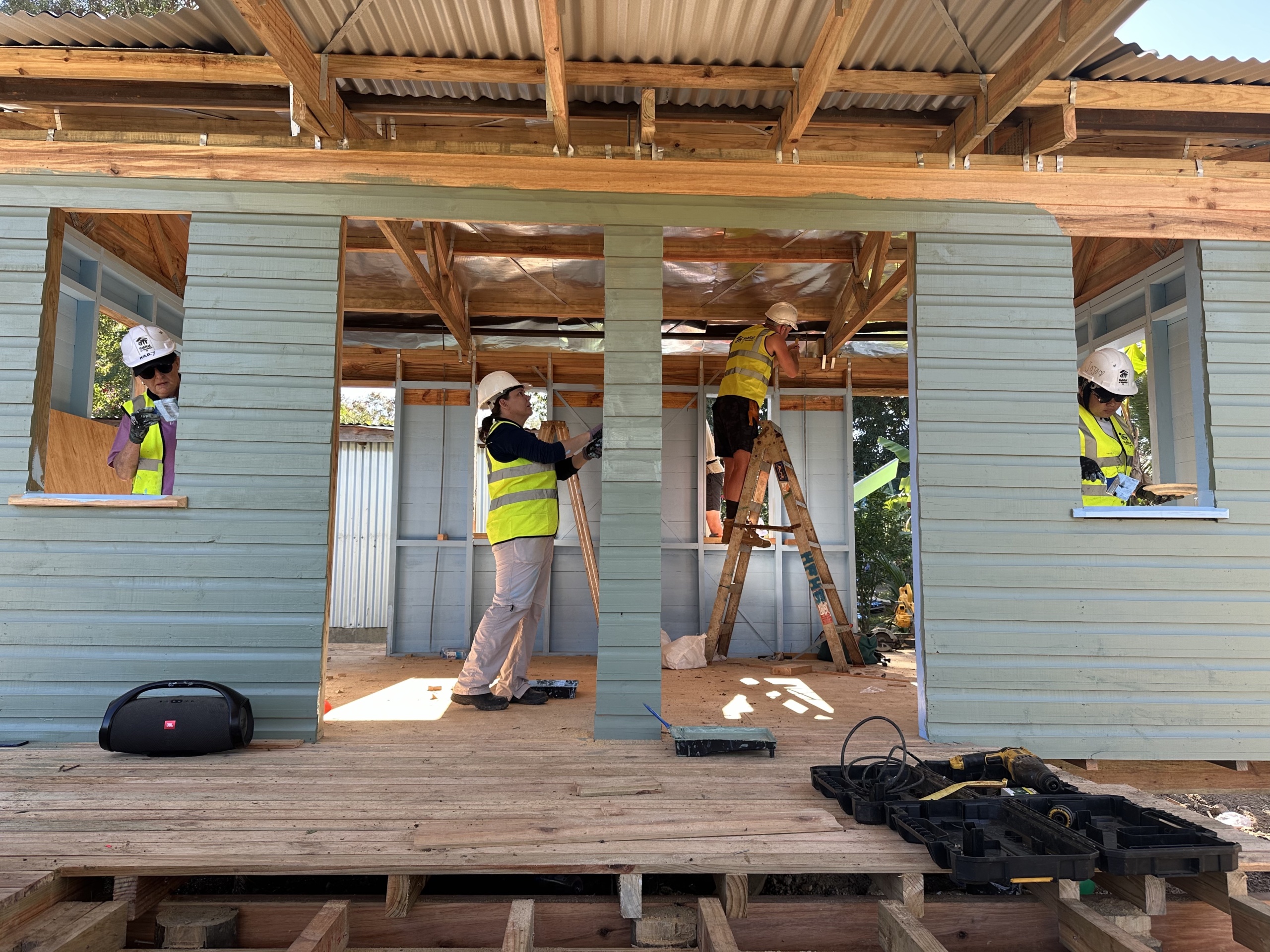 Global Village build in Fiji - volunteers build inside a home