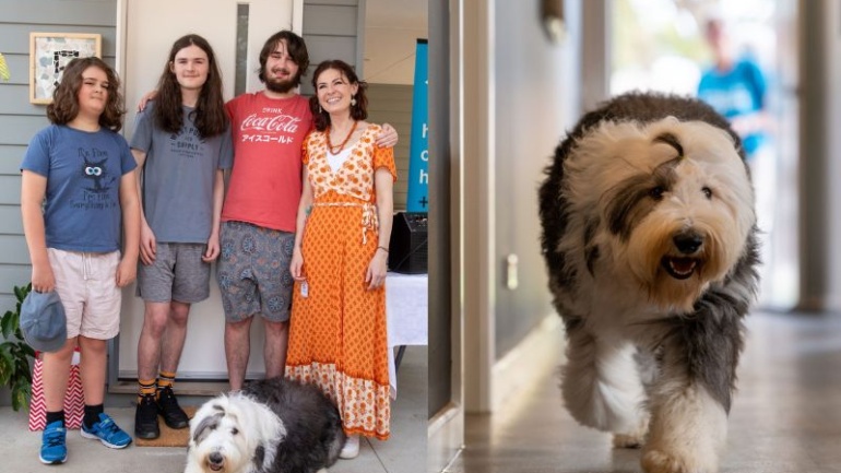 family outside property with dog